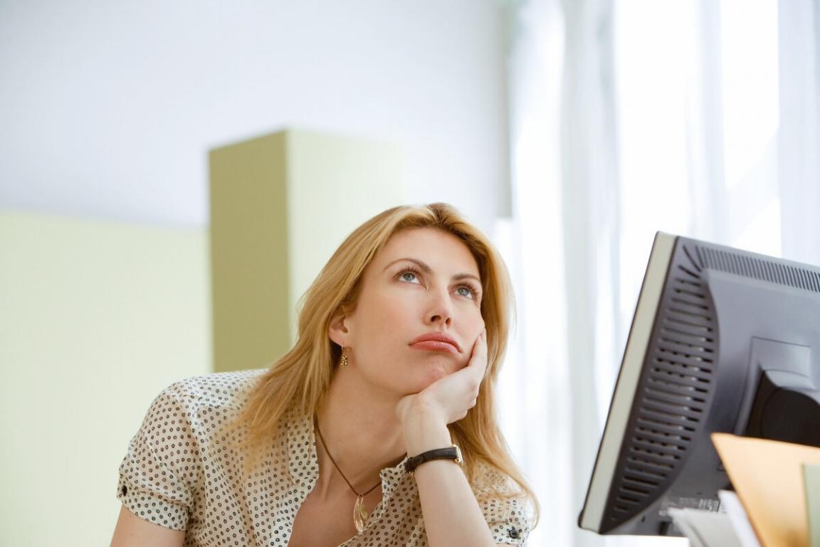 Financial analyst reviewing statistical models and data visualizations